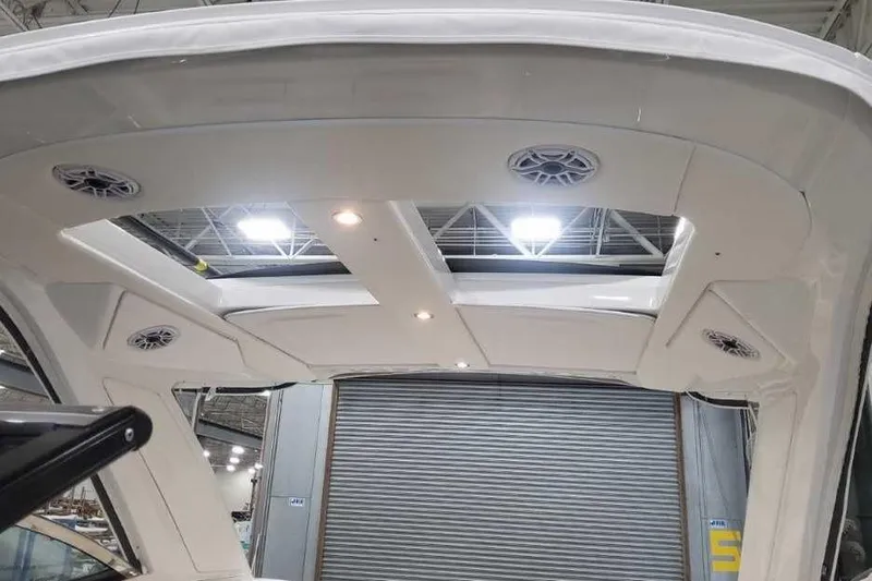 Slide: The Image of 2027 Formula 360 Crossover Bowrider I/O boat interior ceiling with built-in speakers and lights. - 55