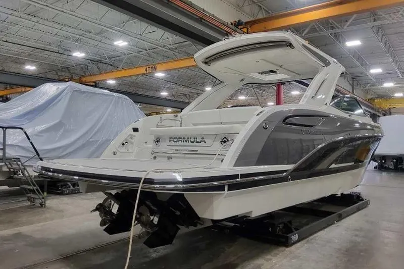 Slide: The Image of 2027 Formula 360 Crossover Bowrider I/O in a showroom, showcasing sleek design and modern features. - 5