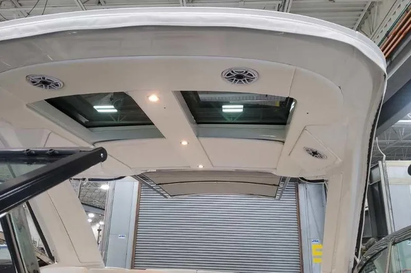 Slide: The Image of 2027 Formula 360 Crossover Bowrider I/O with sleek roof design and integrated lighting. - 56
