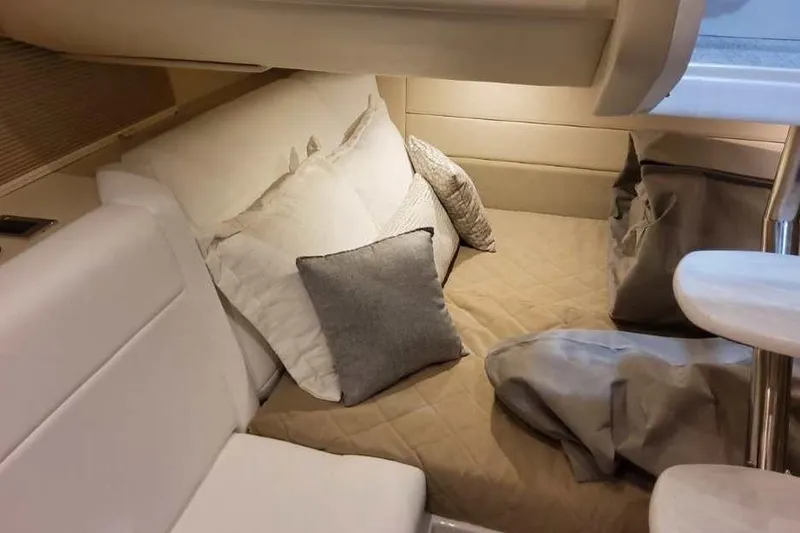 Slide: The Image of Cozy interior cabin of 2027 Formula 360 Crossover Bowrider I/O with plush bedding. - 67