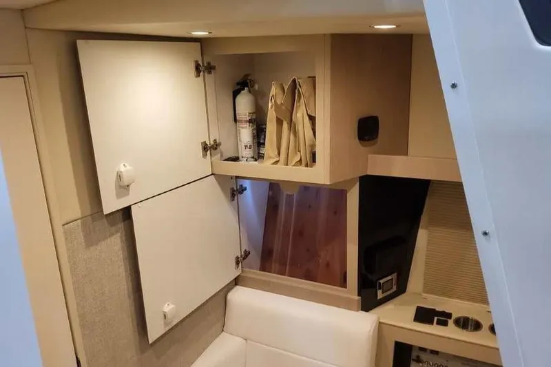 Slide: The Image of Interior of 2027 Formula 360 Crossover Bowrider I/O with open cabinets and seating. - 62