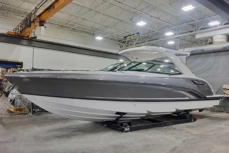 The Image of 2027 Formula 360 Crossover Bowrider I/O in a showroom, showcasing sleek design. - 0