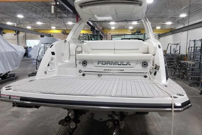 Slide: The Image of 2027 Formula 360 Crossover Bowrider I/O in a spacious indoor facility. - 7