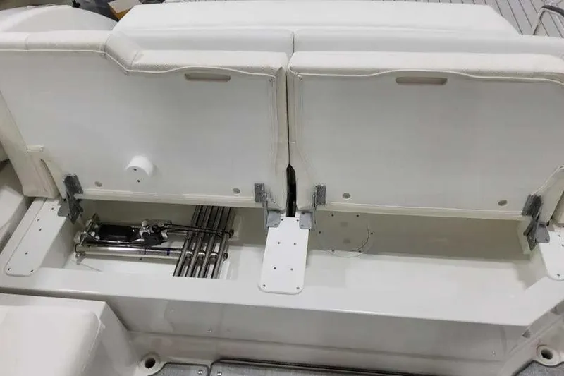 Slide: The Image of 2027 Formula 360 Crossover Bowrider I/O seating storage compartment with mechanical components visible. - 19