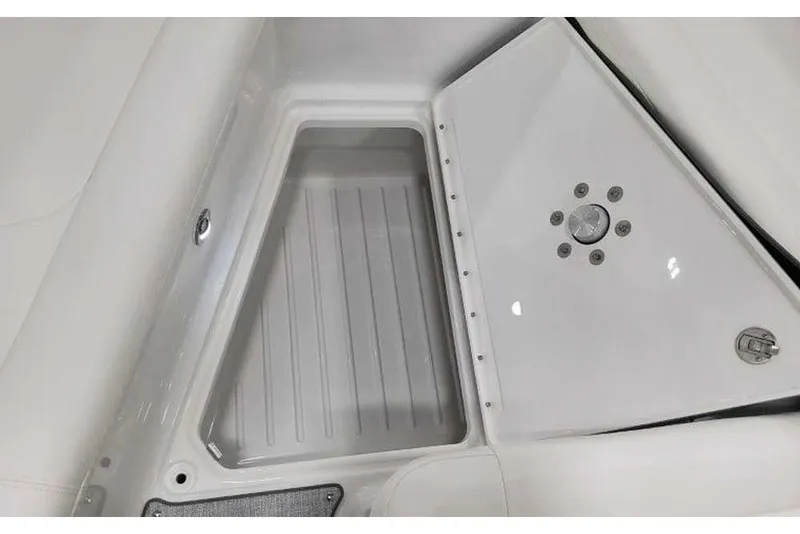 Slide: The Image of Storage compartment of 2027 Formula 360 Crossover Bowrider I/O, featuring sleek white interior design. - 53