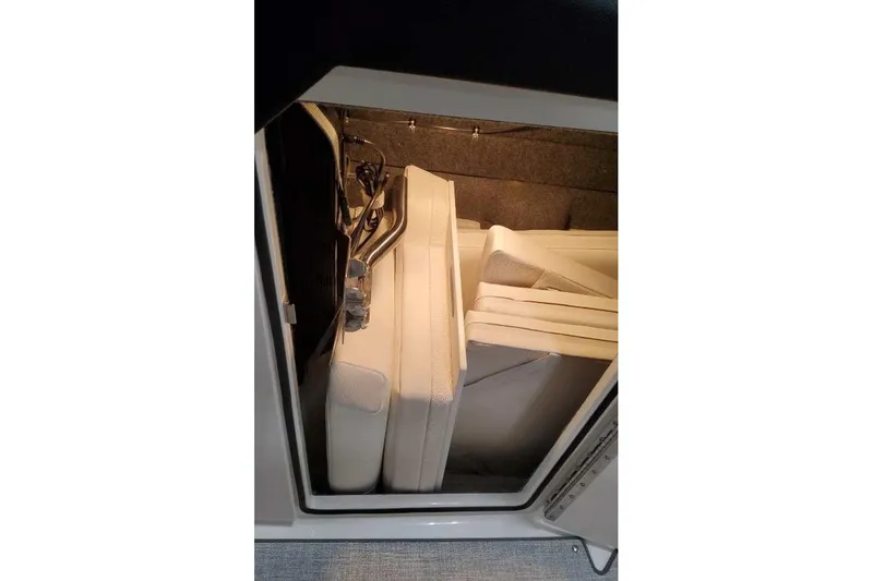 Slide: The Image of Storage compartment in 2027 Formula 360 Crossover Bowrider I/O, featuring neatly stacked cushions. - 38