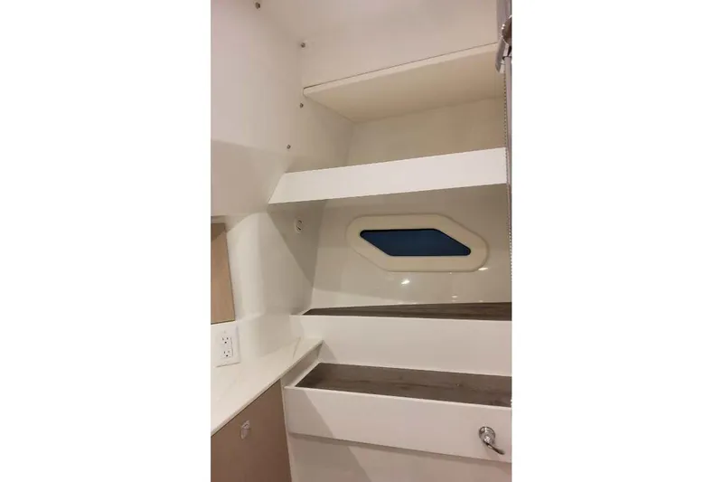 Slide: The Image of Interior of 2027 Formula 360 Crossover Bowrider I/O, featuring sleek shelving and modern design. - 77