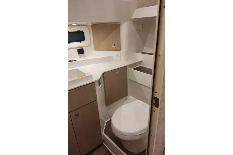 Slide: The Image of 2027 Formula 360 Crossover Bowrider I/O bathroom with modern fixtures and compact design. - 74