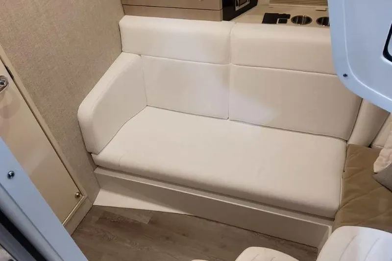 Slide: The Image of Interior seating of 2027 Formula 360 Crossover Bowrider I/O, featuring white upholstery. - 59