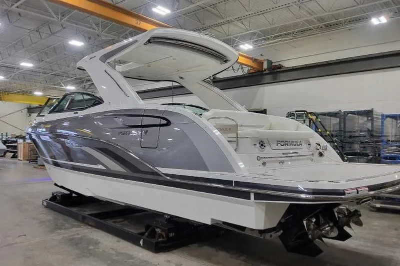Slide: The Image of 2027 Formula 360 Crossover Bowrider I/O in a showroom, showcasing sleek design and modern features. - 4