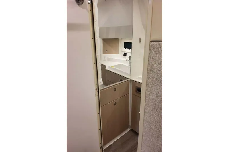 Slide: The Image of Interior view of 2027 Formula 360 Crossover Bowrider I/O, featuring modern cabinetry and sink. - 72