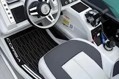 Slide: The Image of 2023 Barletta Corsa 23 UCA boat interior with steering wheel and seating. - 10