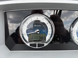 Slide: The Image of Close-up of 2023 Barletta Corsa 23 UCA dashboard gauge displaying RPM and digital readout. - 5