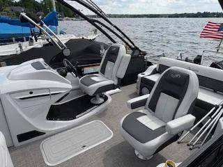 Slide: The Image of 2023 Barletta Corsa 23 UCA boat interior with plush seating and lake view. - 8