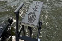 Slide: The Image of 2023 Barletta Corsa 23 UCA boat platform on water, featuring logo and sleek design. - 9