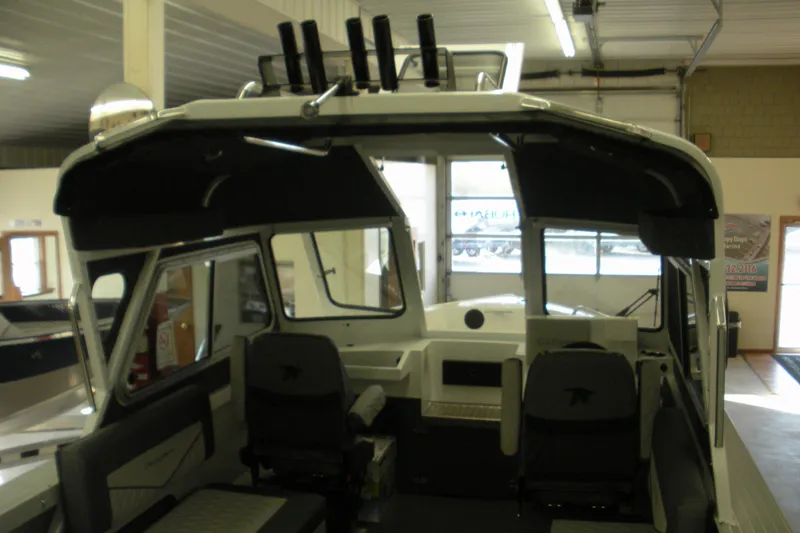 Slide: The Image of Interior view of a 2026 Duckworth 21 Discovery boat in a showroom. - 13
