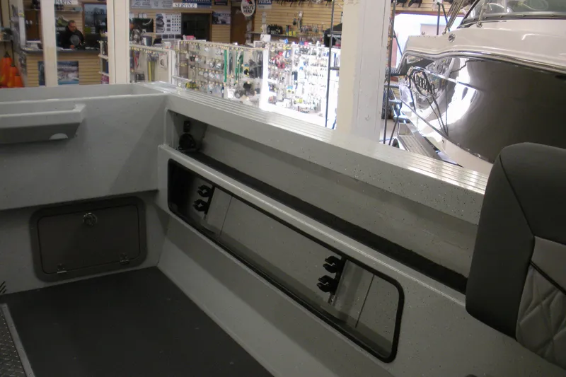 Slide: The Image of Interior of 2026 Duckworth 21 Discovery boat, showcasing storage and seating features. - 14