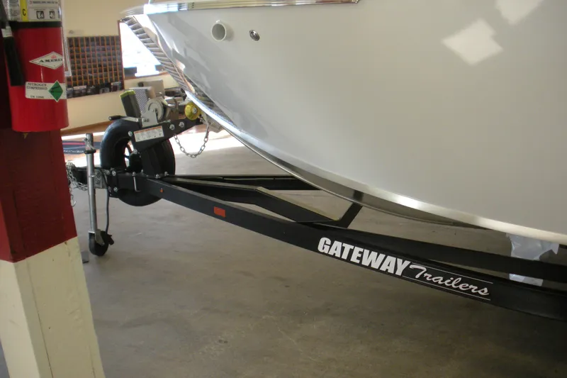 Slide: The Image of 2026 Duckworth 21 Discovery boat on Gateway trailer in garage setting. - 19