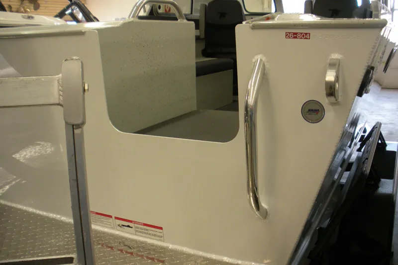 Slide: The Image of 2026 Duckworth 21 Discovery boat interior with seating and metal handrails. - 23