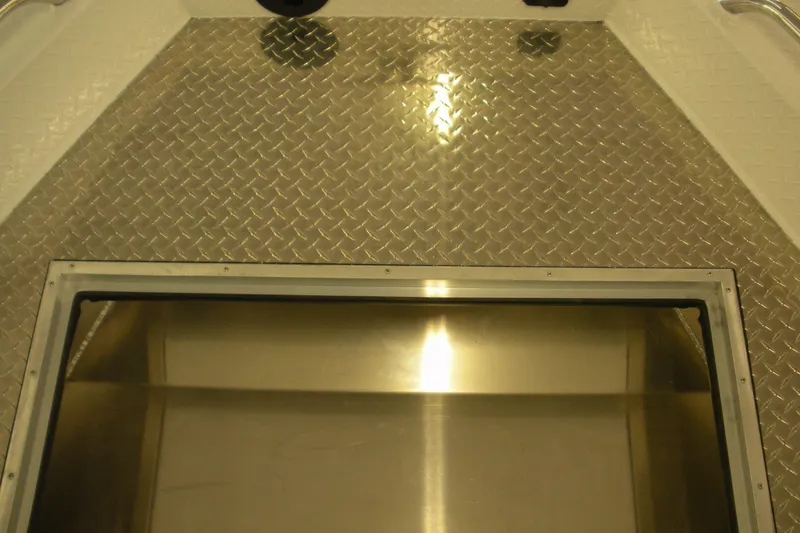 Slide: The Image of Interior of 2026 Duckworth 21 Discovery boat with diamond plate flooring. - 4