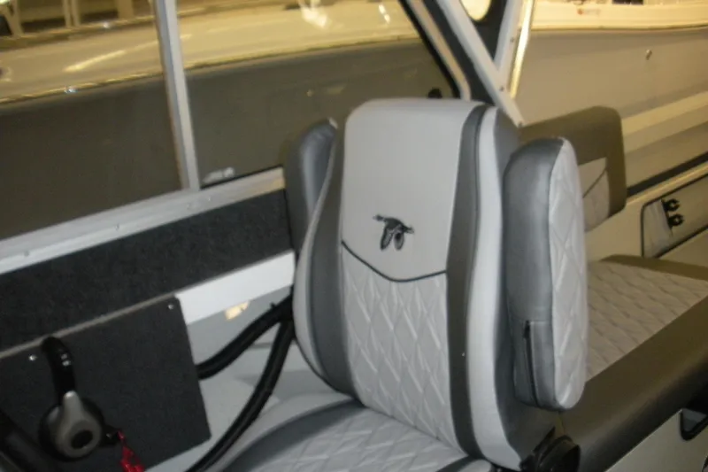Slide: The Image of Interior of a 2026 Duckworth 21 Discovery boat, featuring a stylish, cushioned seat design. - 8