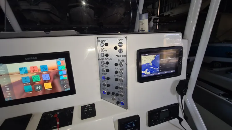 Slide: The Image of Control panel of a 2021 Clearwater 2800 CC boat with navigation screens. - 15