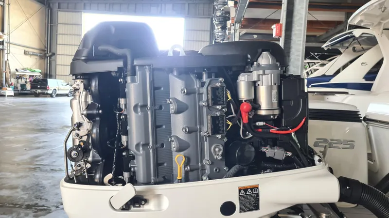 Slide: The Image of Outboard motor of a 2021 Clearwater 2800 CC boat in a storage facility. - 28