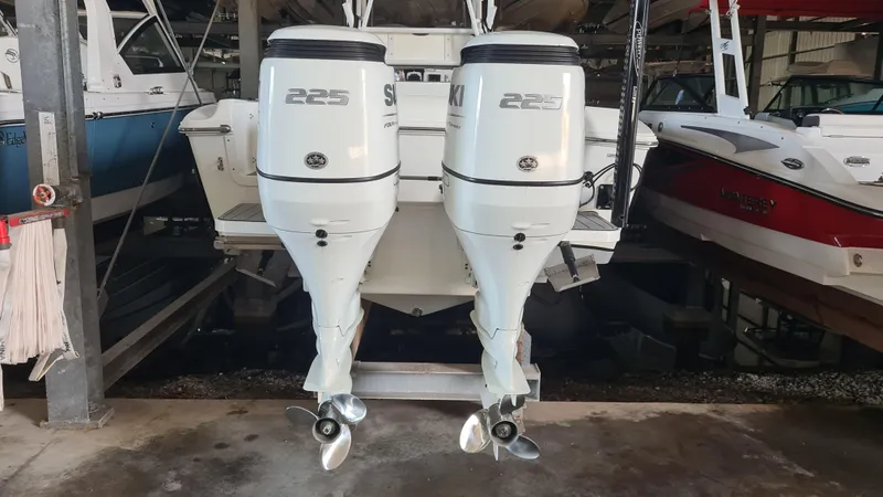 Slide: The Image of Twin 225 horsepower outboard engines on a 2021 Clearwater 2800 CC boat. - 5