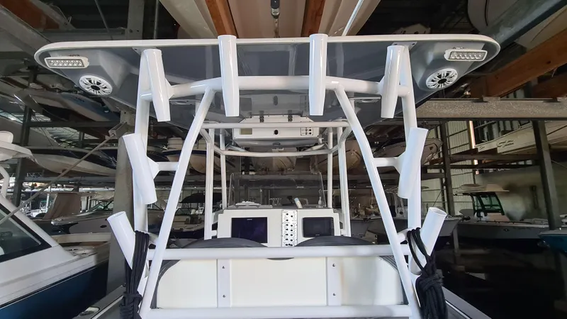 Slide: The Image of 2021 Clearwater 2800 CC boat interior with modern navigation equipment and sturdy framework. - 20