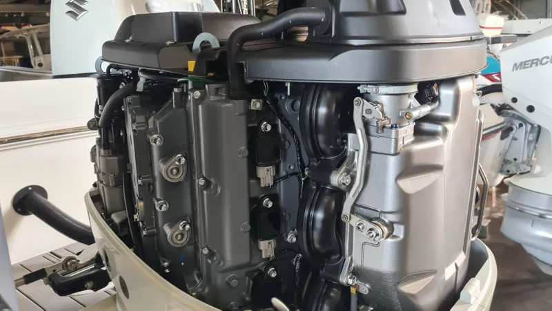 Slide: The Image of 2021 Clearwater 2800 CC boat engine close-up in a workshop setting. - 29