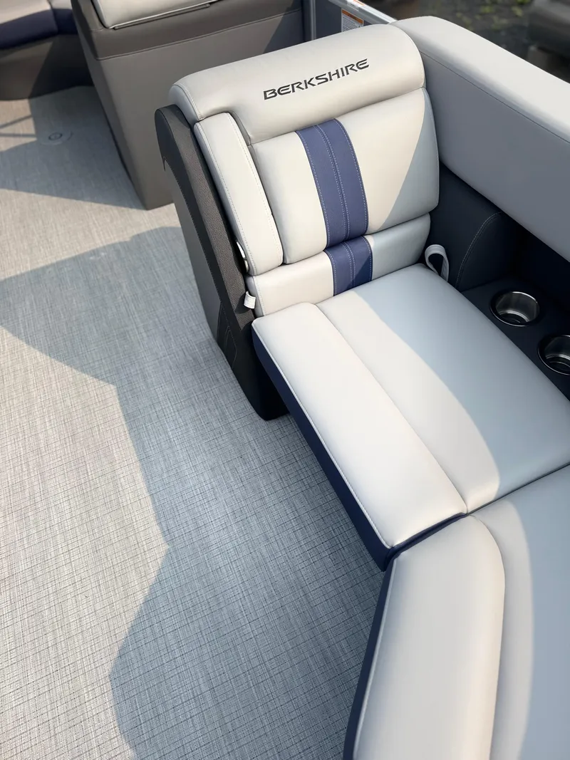 Slide: The Image of 2025 Berkshire 22CL CTS boat interior with stylish seating and cup holders. - 6