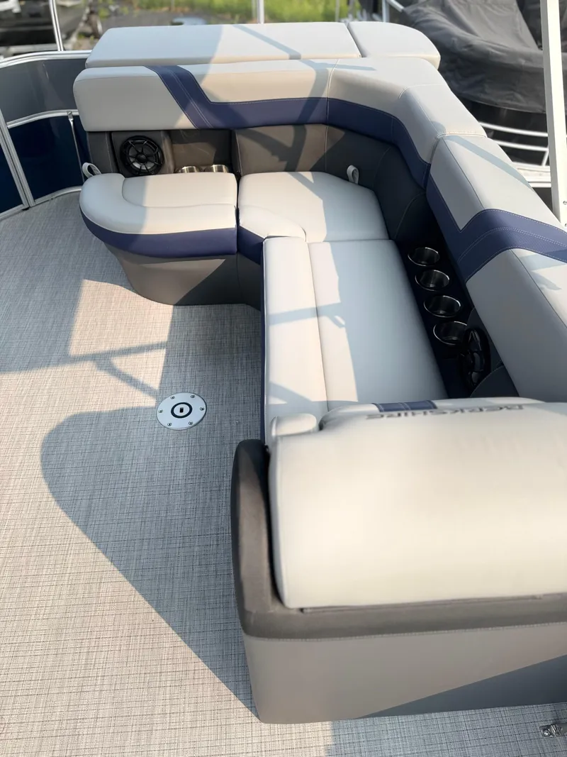 Slide: The Image of 2025 Berkshire 22CL CTS pontoon boat interior with cushioned seating and cup holders. - 7