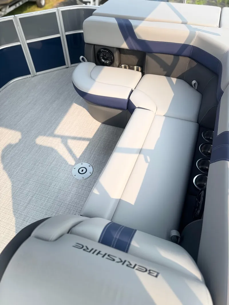 Slide: The Image of 2025 Berkshire 22CL CTS boat interior with cushioned seating and modern design. - 8