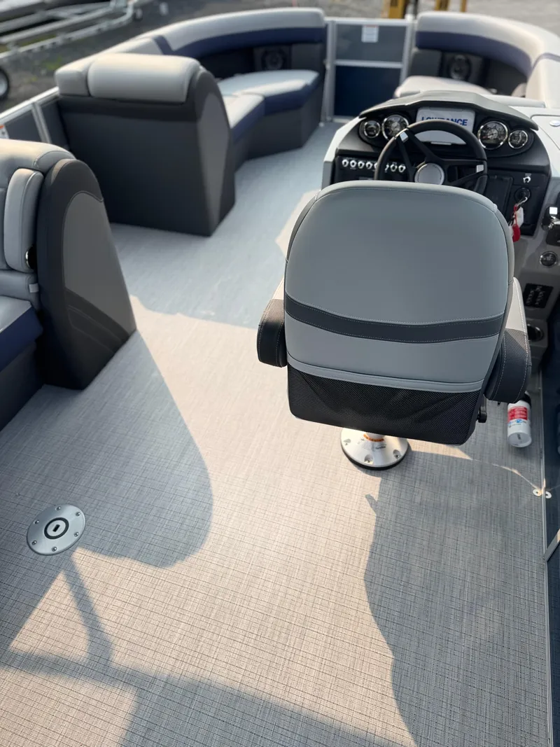 Slide: The Image of 2025 Berkshire 22CL CTS pontoon boat interior with modern seating and steering console. - 9