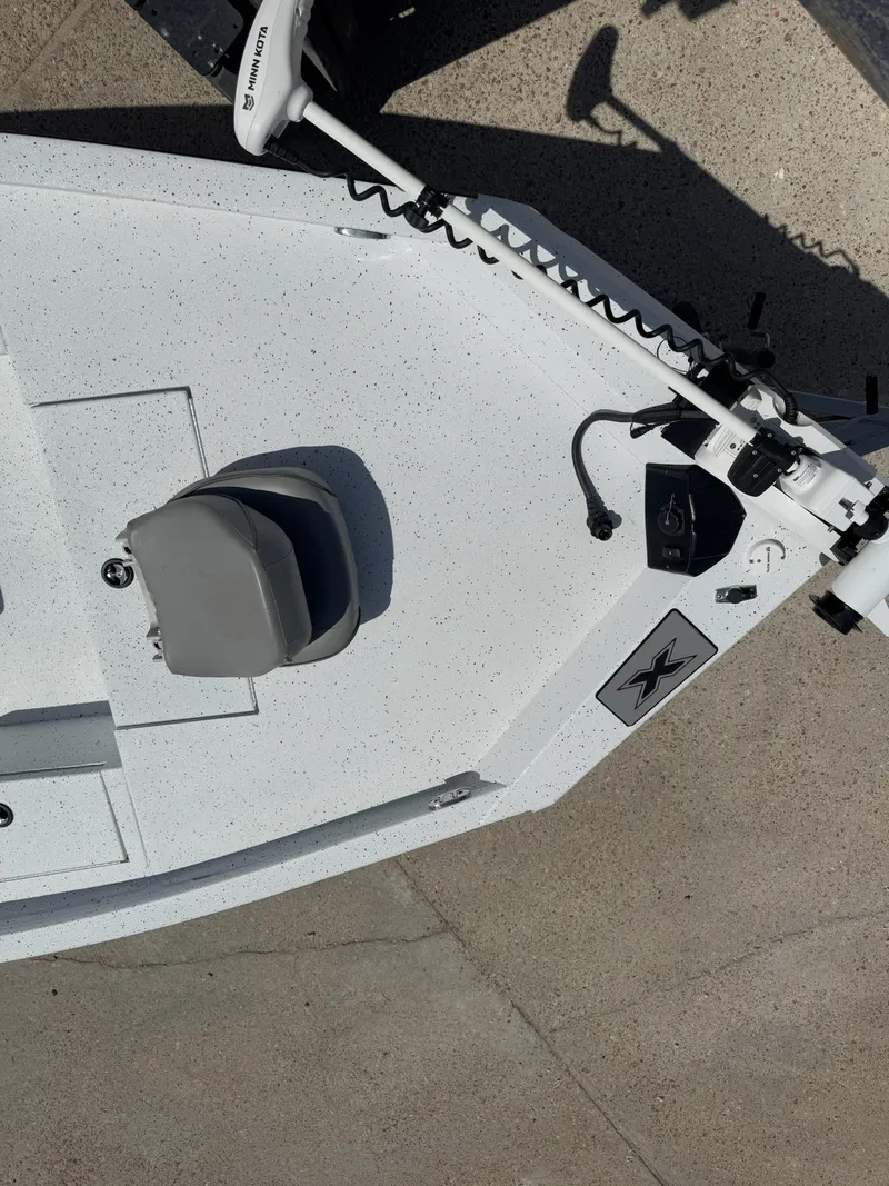Slide: The Image of 2022 Xpress H20B boat deck with seat and trolling motor. - 17