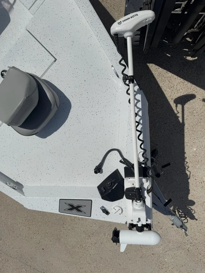 Slide: The Image of 2022 Xpress H20B boat with Minn Kota trolling motor on deck. - 18