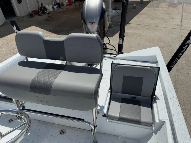 Slide: The Image of 2022 Xpress H20B boat seats with gray upholstery and diamond stitching. - 25