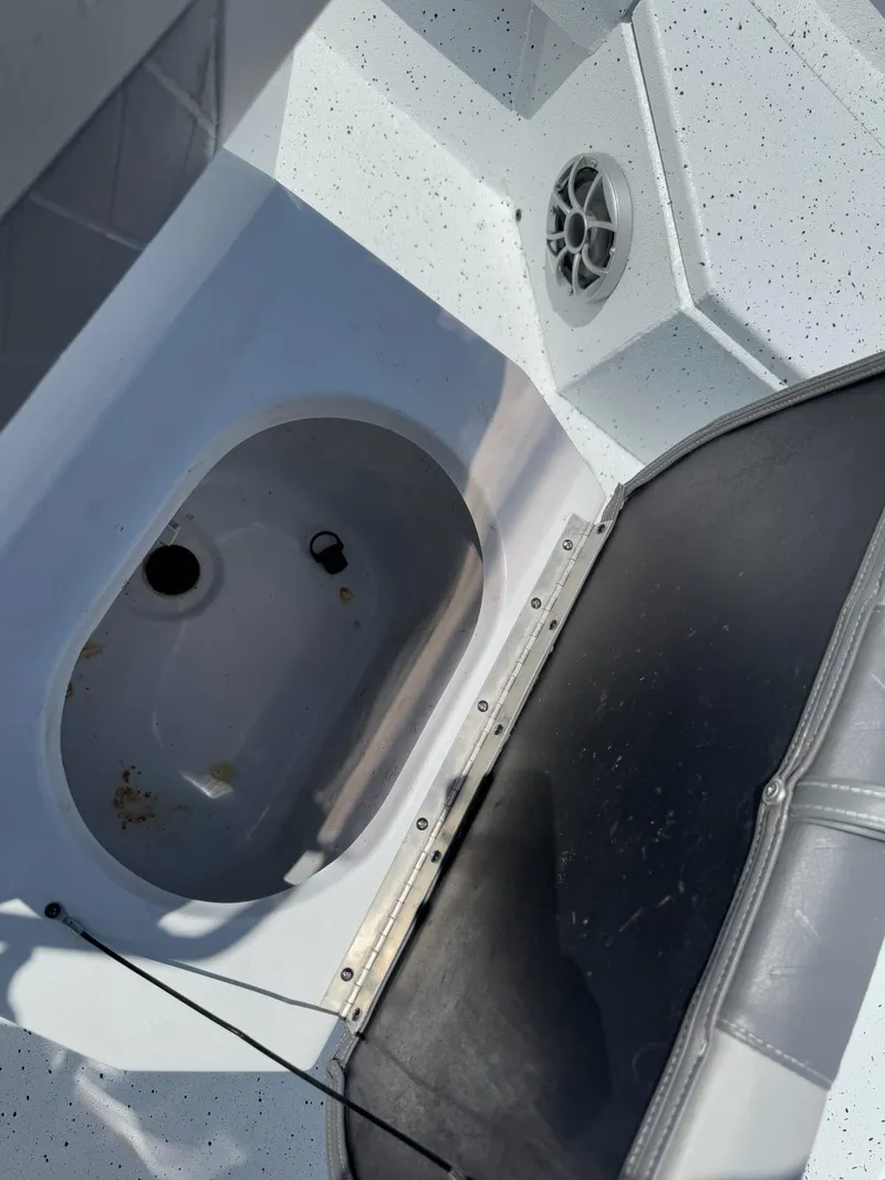 Slide: The Image of Open storage compartment in 2022 Xpress H20B boat interior. - 28