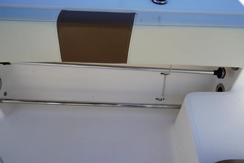 Slide: The Image of 2017 Robalo R200ES boat interior detail with storage compartment and seating. - 11