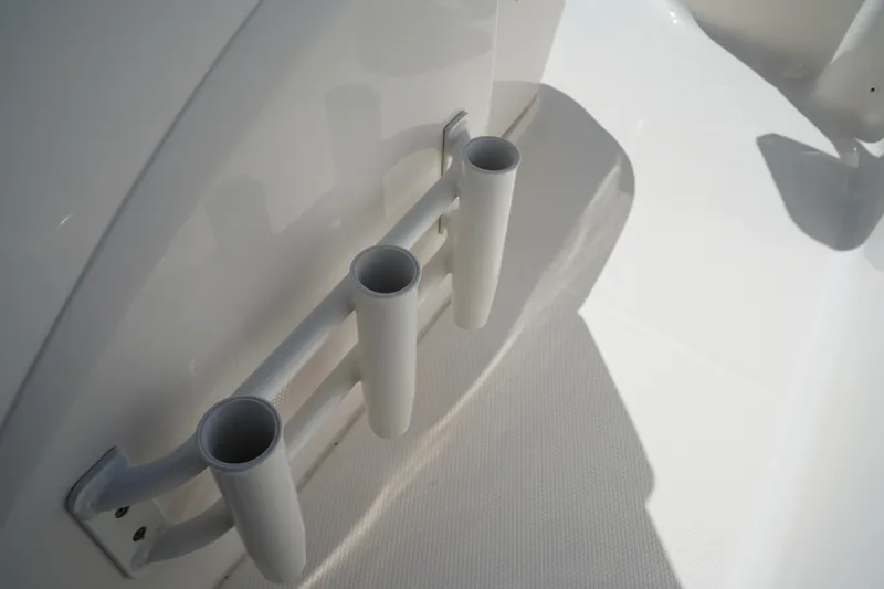 Slide: The Image of Rod holders on a 2017 Robalo R200ES boat deck, showcasing sleek design. - 19