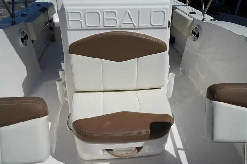 Slide: The Image of 2017 Robalo R200ES boat seat with brown and white upholstery. - 21