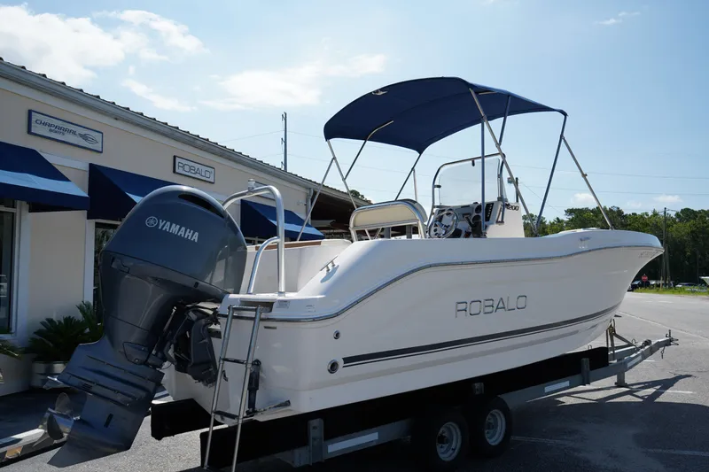 Slide: The Image of 2017 Robalo R200ES boat with Yamaha engine on trailer, parked outside dealership. - 6