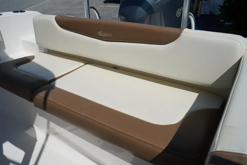 Slide: The Image of 2017 Robalo R200ES boat seating with brown and cream upholstery. - 7