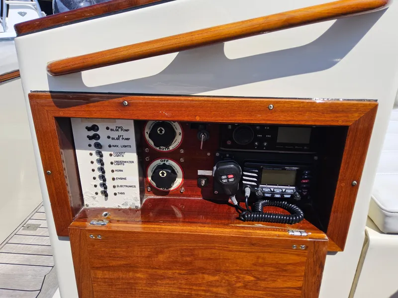 Slide: The Image of Control panel of a 1989 Boca Grande 26 boat with radio and switches. - 20