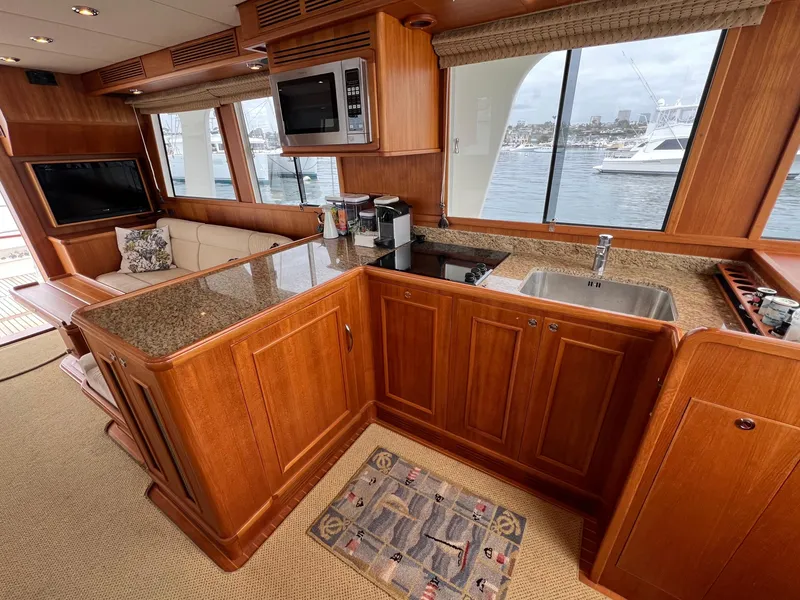 Slide: The Image of Luxurious 2008 Grand Banks 47 Heritage EU yacht interior with elegant wood cabinetry and modern amenities. - 12
