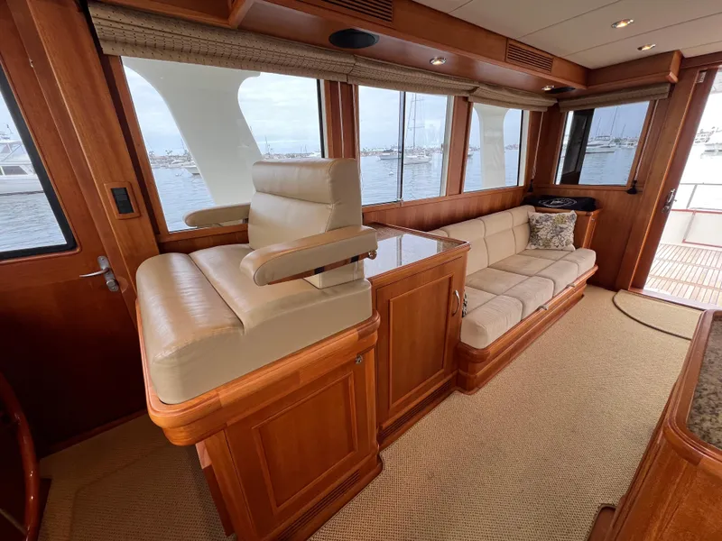 Slide: The Image of Luxurious interior of 2008 Grand Banks 47 Heritage EU yacht with plush seating and wood finishes. - 15