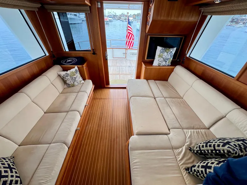 Slide: The Image of Luxurious interior of 2008 Grand Banks 47 Heritage EU yacht with plush seating and elegant wood finish. - 24