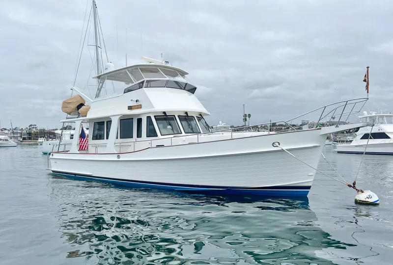 Slide: The Image of 2008 Grand Banks 47 Heritage EU yacht anchored in a calm marina. - 3