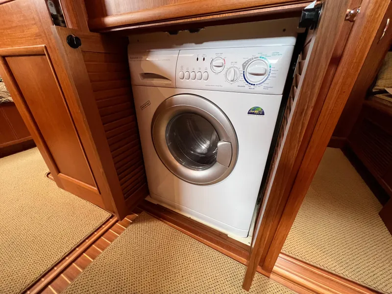 Slide: The Image of Washer in wooden cabinet on 2008 Grand Banks 47 Heritage EU yacht. - 32