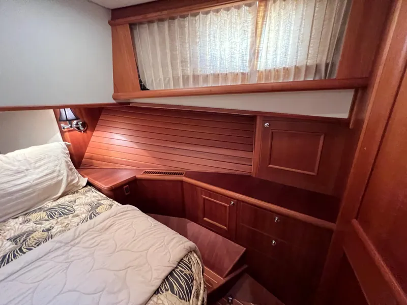 Slide: The Image of Luxurious 2008 Grand Banks 47 Heritage EU cabin with wood paneling and cozy bedding. - 35